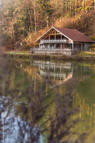 wooden house by the river