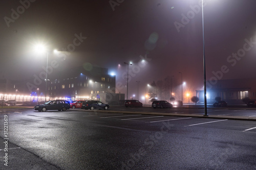 City landscape at foggy night. Long exposure. Light trails.