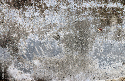Traces of time left on the wall. Old concrete background. Faded walls. Abstract textures.