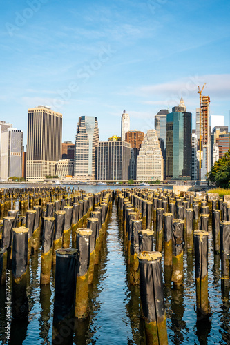 The view of Manhattan skyline and Brookyn bridge from Brooklyn side after sunrise , New york city photo