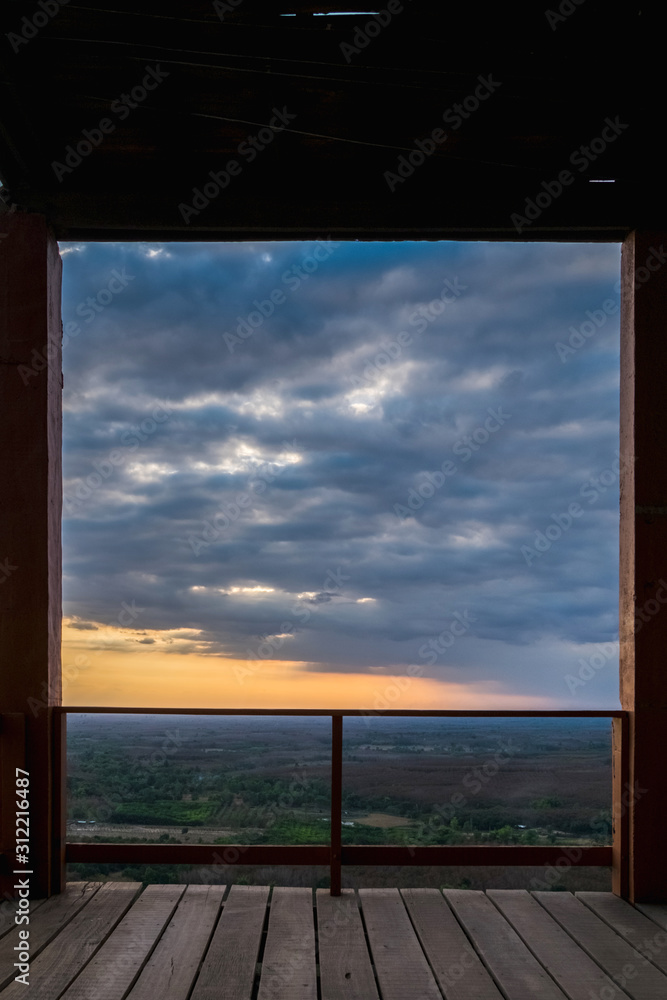 Sunset at Phu Thok, Thailand Under a wooden frame that is like a picture frame with a natural view inside