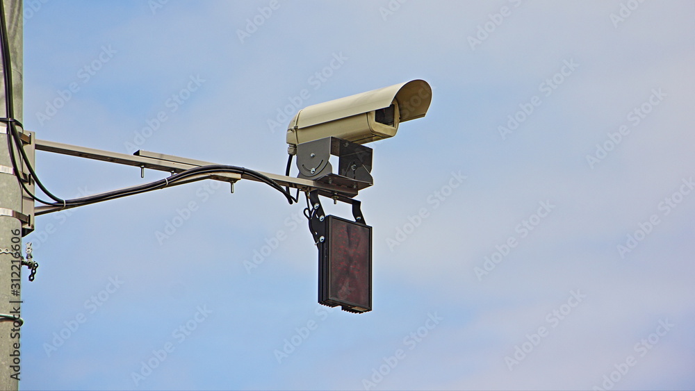 Road speed gun control camera close up view in Moscow on blue sky background Road speed gun control camera close up view in Moscow on blue sky background