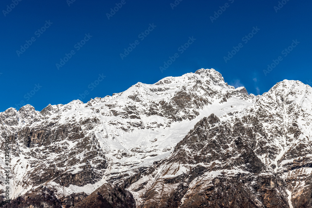 Winter mountains, in Lizzola, Bergamo, Italy. snow capped peaks of the Italian Alps