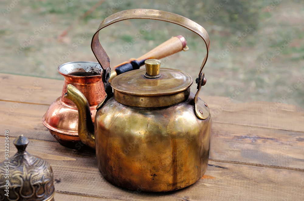 Antique brass teapot and copper coffee maker Antique brass teapot and copper coffee maker