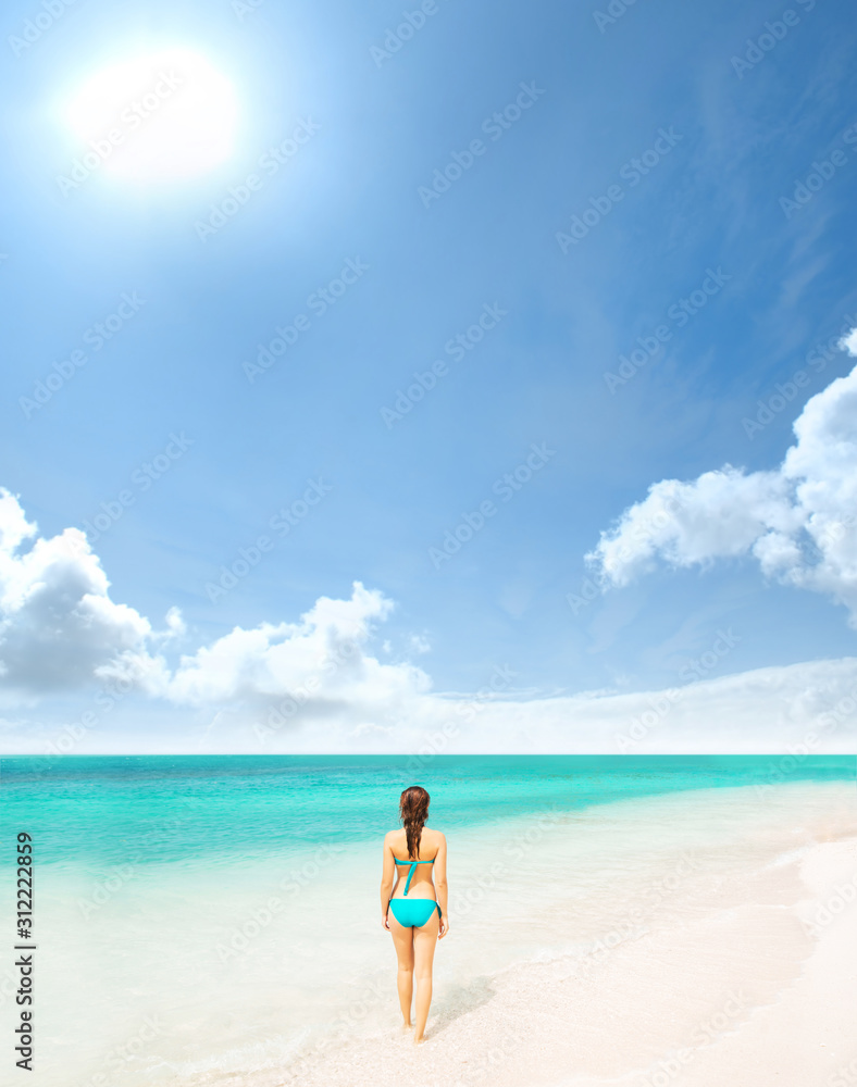 Young and beautiful woman in swimsuit relaxing on the beach. Girl having summer vacation in Thailand. Holidays and traveling.