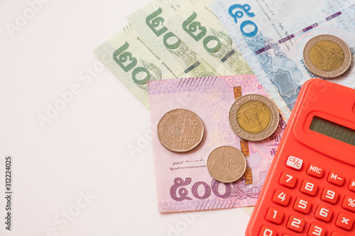 Thailand Baht, Chinese Yuan, US Dollar banknotes and Thailand Baht coin. calculation amount of money