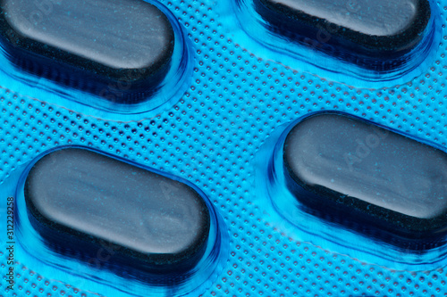 Obraz na plátně Blue tablets in blister pack arranged with beautiful pattern