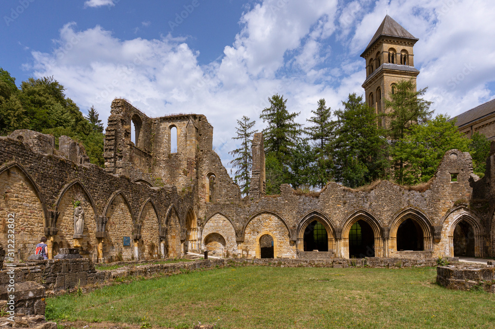 Orval Abbey, in Belgium. Ruins of the Cistercian monastery and the Gothic church. Travel by car in summer Orval Abbey, in Belgium. Ruins of the Cistercian monastery and the Gothic church. Travel by car in summer