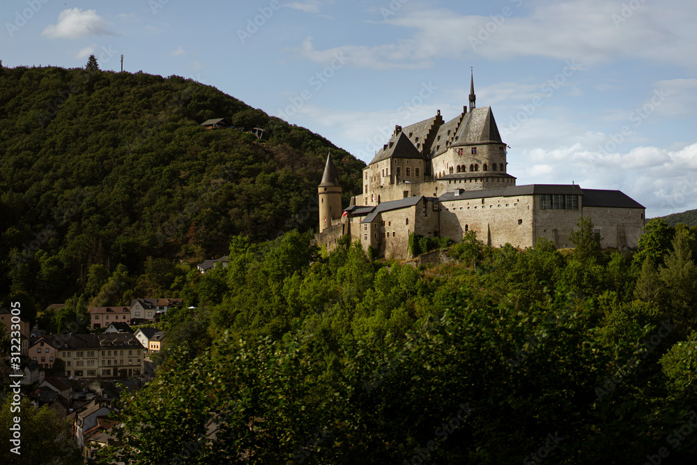 Panoramic view of the medieval castle of Vianden, Luxembourg, on a hill in the forest