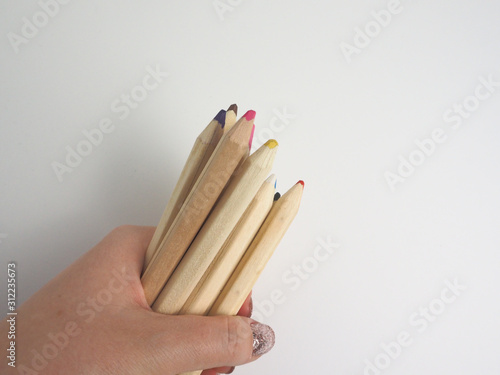 hand with pencils