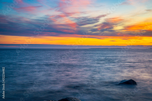 Long exposure seascape along Nova Scotia s rocky seacoast shoreline.