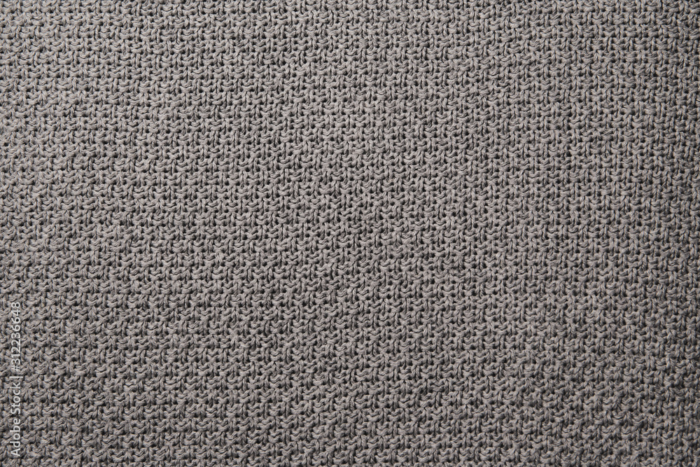 Knitted fabric wool texture close up as a background. Knitted fabric wool texture close up as a background.