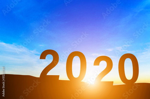 Happy New Year 2020, Silhouette the hill early morning sunrise over the horizon background, Happy new year concept.