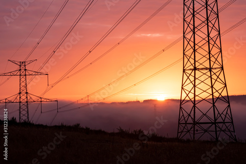 high voltage post,High voltage tower sky surise background