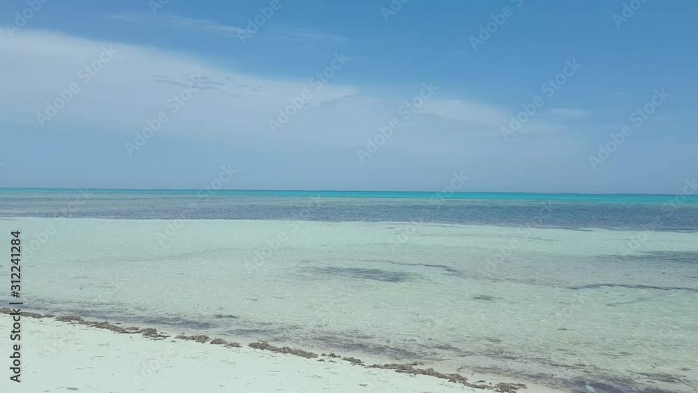 Round in the beautiful white beach during watching blue sea in Cuba Round in the beautiful white beach during watching blue sea in Cuba