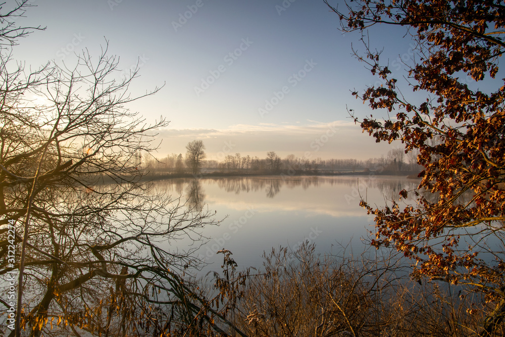 Quiet lake in a winter sunrise