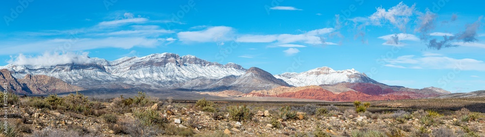 USA, Nevada, Clark County, Red Rock Canyon National Conservation Area. A panoroama of Snow covering the mountains above this famous hiking area outside Las Vegas