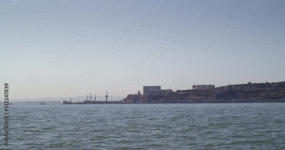 Cacilhas view from moving boat. Shot at river Tejo ,Almada,Portugal Cacilhas view from moving boat. Shot at river Tejo ,Almada,Portugal