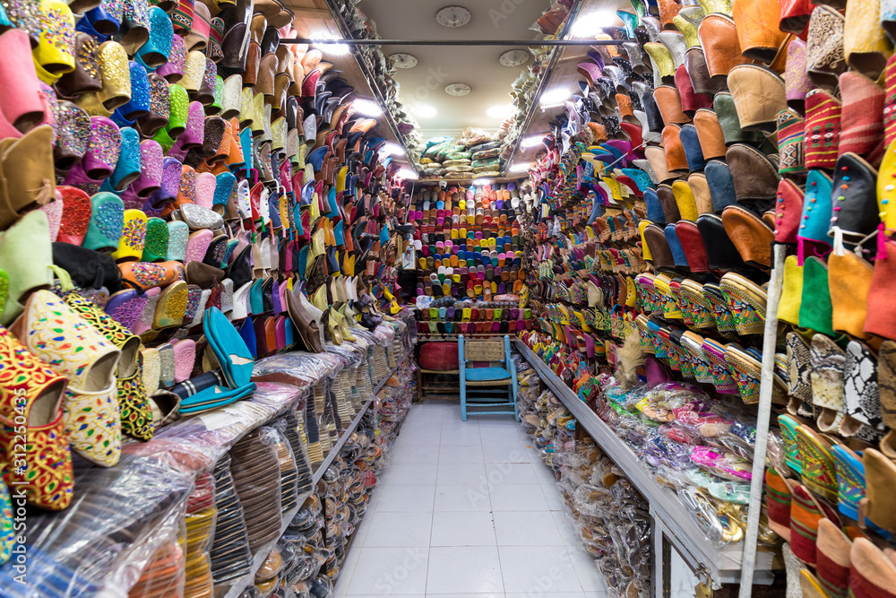 The traditional handmade leather handbag and slippers and other product is displayed in the tannery and showroom in the souk of Fes. Morocco