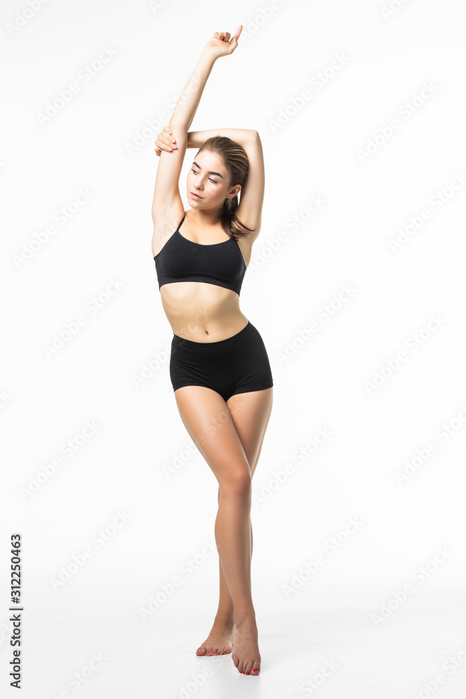 Full height of fitness woman with a beautiful body in black lingerie isolated on white background