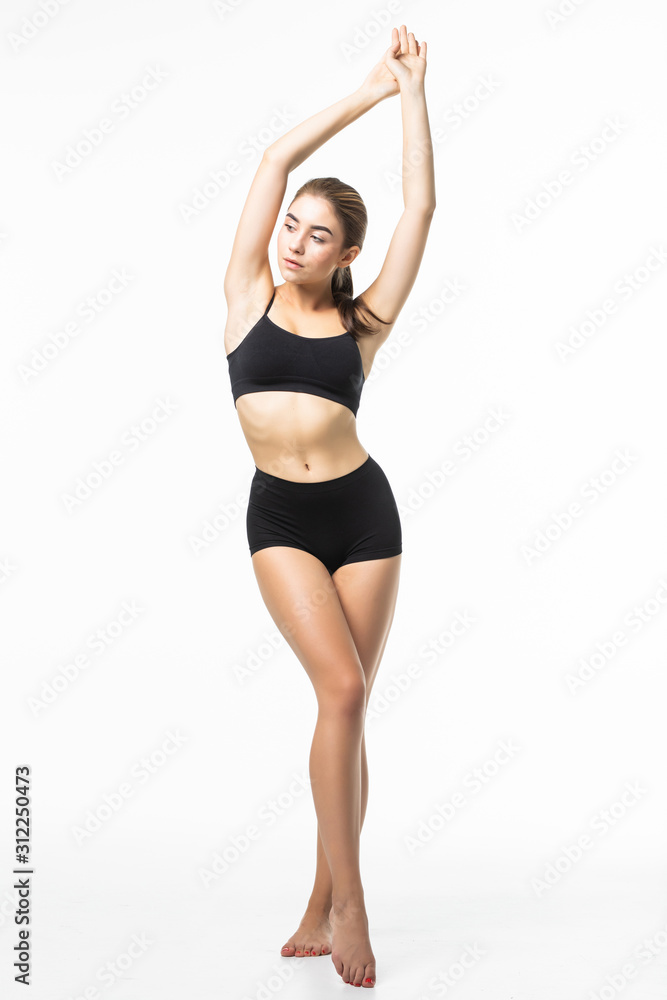 Full height of fitness woman with a beautiful body in black lingerie isolated on white background Full height of fitness woman with a beautiful body in black lingerie isolated on white background