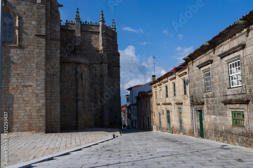 Guarda,Portugal,6,2008; The historic center is still protected by walls and medieval towers. Narrow streets, old granite houses with gothic windows and gargoyles