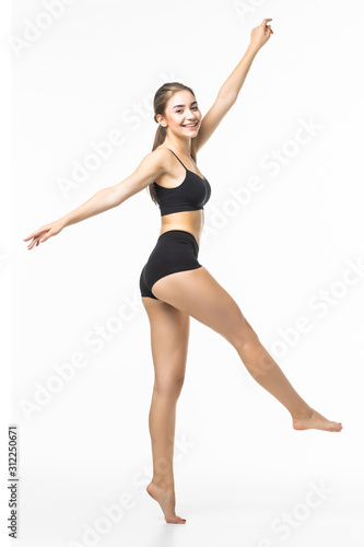 Wallpaper Mural Full length portrait of a young brunette woman with perfect body raised hands in black sport lingerie posing and looking away isolated on a white background Torontodigital.ca