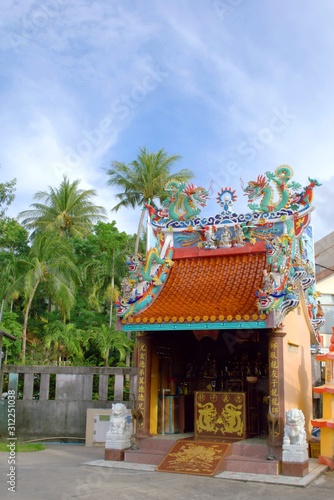 Dragons  ornaments and other religious symbols on a Chinese shrine in Phuket  Thailand. 