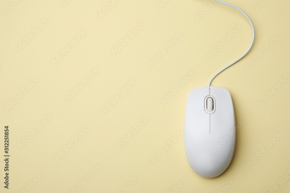 Wired computer mouse on yellow background, top view. Space for text Wired computer mouse on yellow background, top view. Space for text