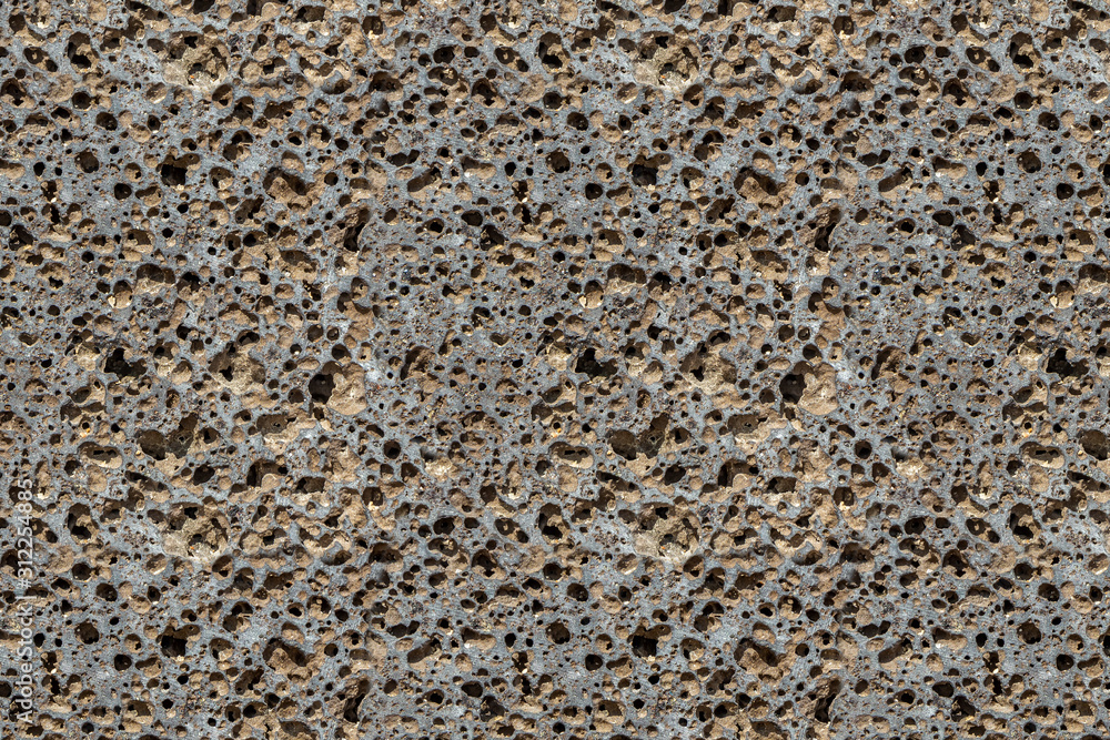 Beautiful texture of orange stone pumice with holes is in the photo Beautiful texture of orange stone pumice with holes is in the photo