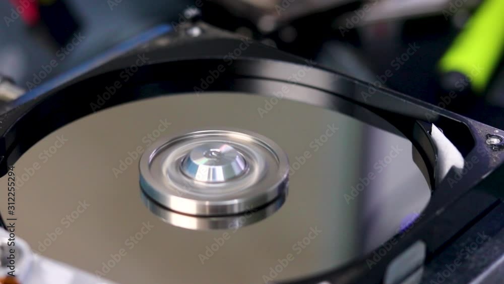 Spinning the disk of a broken hard drive a t a data recovery center to recover the lost data Spinning the disk of a broken hard drive a t a data recovery center to recover the lost data