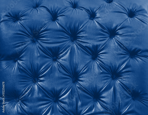 Texture of the skin on couch. Classic blue toning trend 2020 color