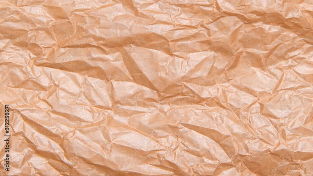 Crumpled brown craft cardboard sheet seamless texture, copy space, motion graphic Crumpled brown craft cardboard sheet seamless texture, copy space, motion graphic