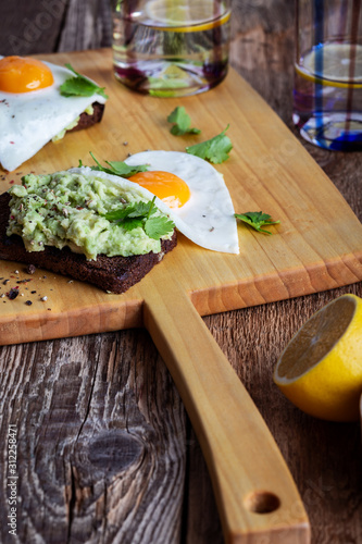 Brunch on Valentine's Day, avocado toasts with fried egg