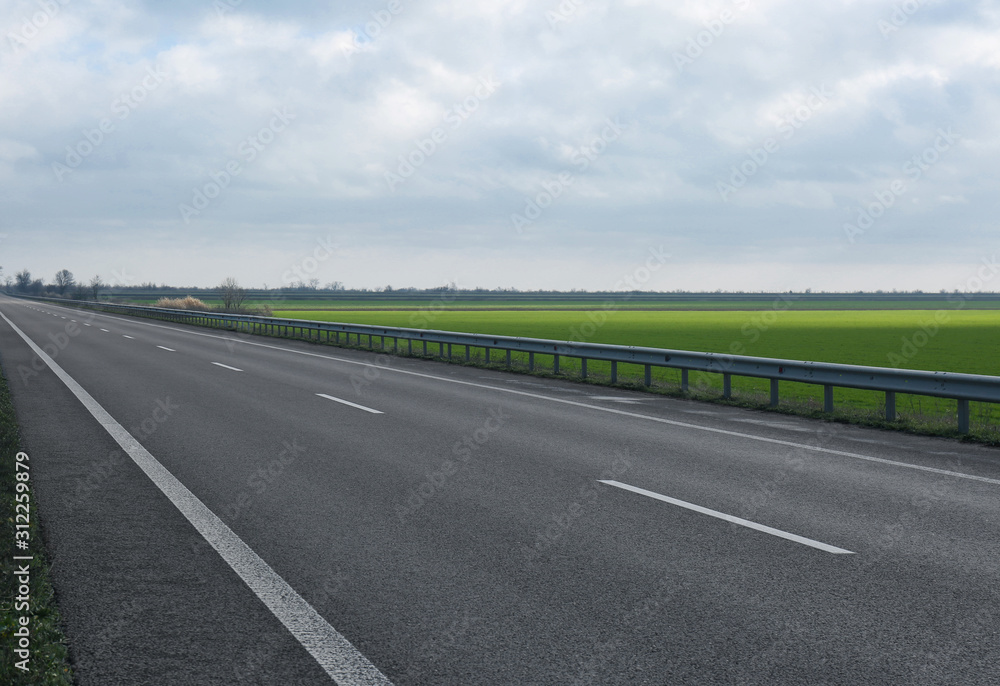 Beautiful view of asphalt highway without transport Beautiful view of asphalt highway without transport