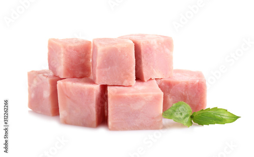 Cubes of tasty fresh ham with basil isolated on white
