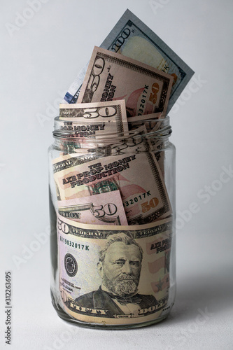 Saving money is important. new 100 dollars, 50 dollars.