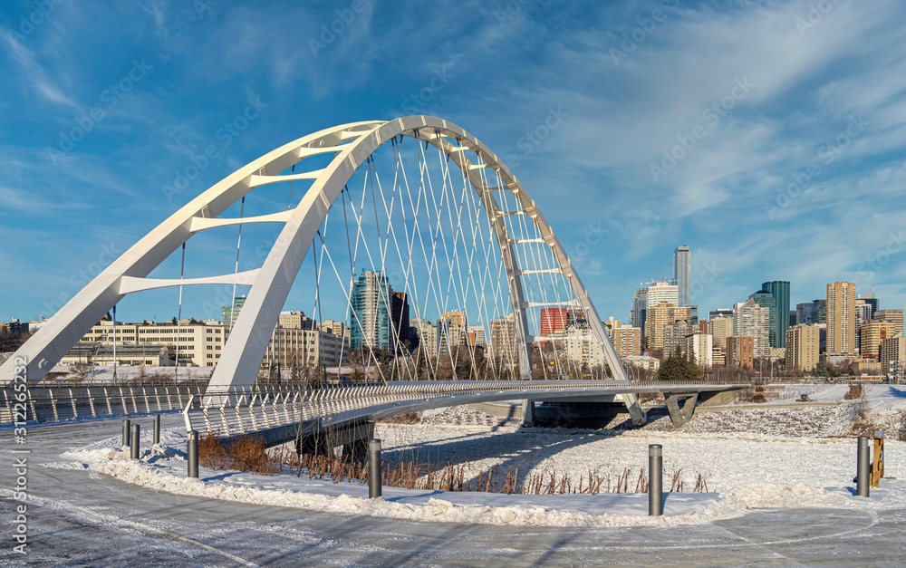 Fototapeta premium Panoramic view of Walterdale suspension bridge and downtown skyline in Edmonton, Alberta, Canada.