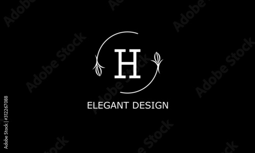 Design of modern monogram on black background with letter H. Vector floral logo.