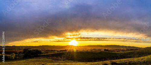 Panoramic Sunset over Green Hills in Country 