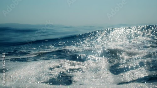 Sea level from moving glass boat. Prores 422 10 Bit slow motion.