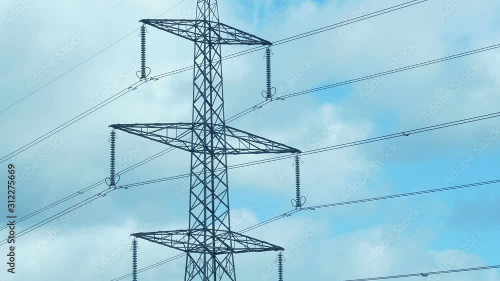 Power Lines And Transmission Tower In The Daytime Power Lines And Transmission Tower In The Daytime
