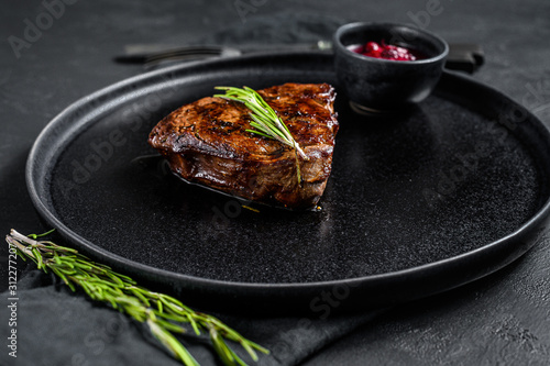 Tenderloin Steak, Roast beef. Black background. Top view
