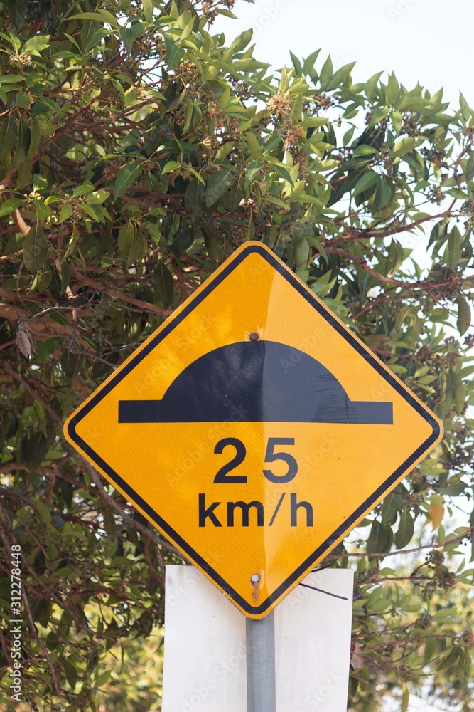 Speed bump sign and speed of 25 km / h. Stock Photo