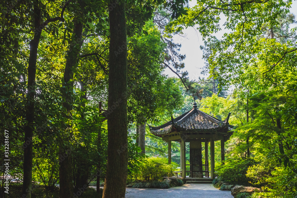 Traditional Chinese pavilion among trees near West Lake, Hangzhou, China Traditional Chinese pavilion among trees near West Lake, Hangzhou, China
