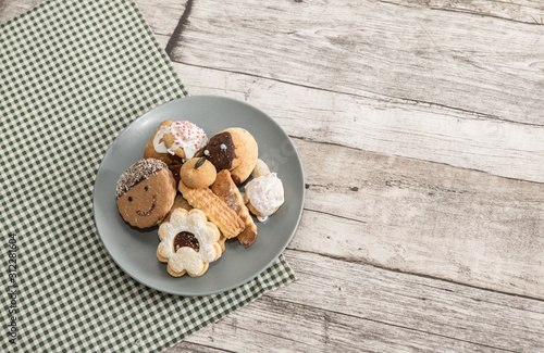 Festive time with home made cookies on the wodden table with wooden background photo