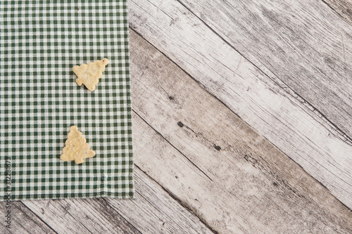 Festive time with home made cookies on the wodden table with wooden background photo