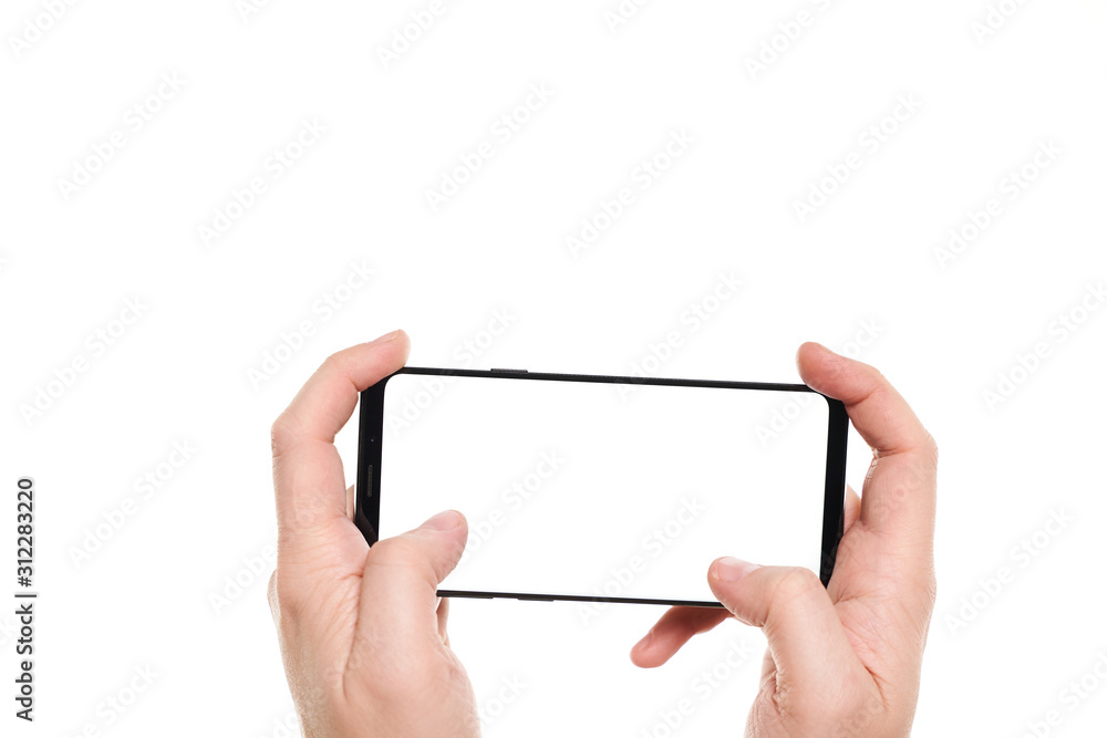 Man hands playing on the black smartphone blank screen with modern frameless design isolated on white background Man hands playing on the black smartphone blank screen with modern frameless design isolated on white background