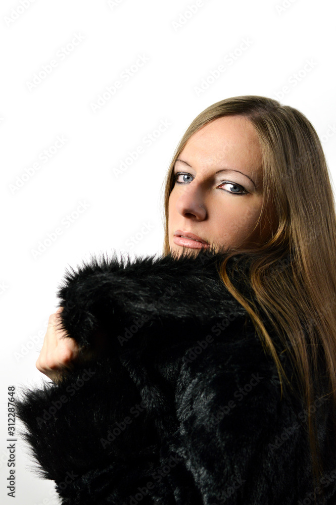 Portrait of beautiful young woman with brown hair in fake fur coat Portrait of beautiful young woman with brown hair in fake fur coat