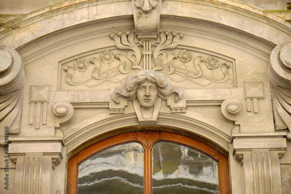 Carved male head figure in Liberty style entrance way,over door entrance in Trieste Italy
